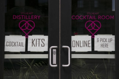 The Stilheart Distillery displays signs offering take-out cocktail kits in the North Loop neighborhood of Minneapolis, Minnesota, U.S., on Saturday,...