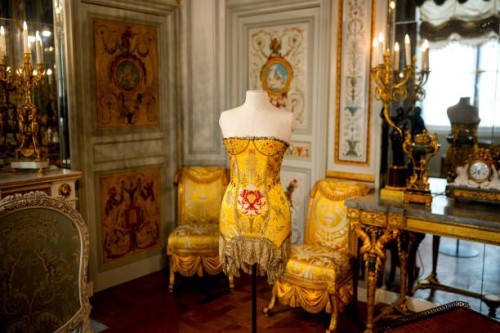 This photograph shows a dress created by Donatella Versace for the fashion house Versace from the Ready-to-Wear 2002-2003 collection displayed at the...