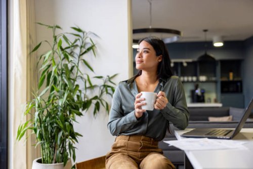thoughtful businesswoman taking a break and drinking a cup of coffee - coffee stock pictures, royalty-free photos & images