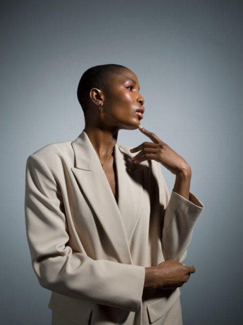 thoughtful, stylish young woman in white blazer - fashion stock pictures, royalty-free photos & images
