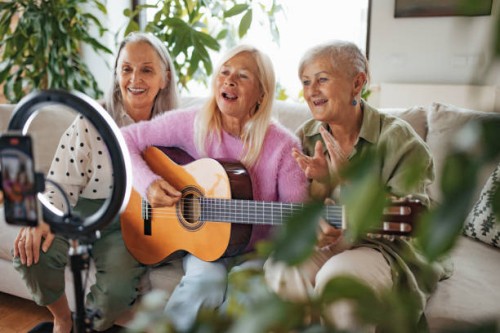 three beautiful senior musicians using social media to share their music. - concert stock pictures, royalty-free photos & images