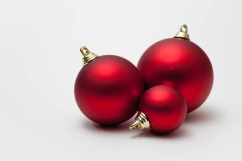 three christmas baubles on white background - home decoration stock pictures, royalty-free photos & images