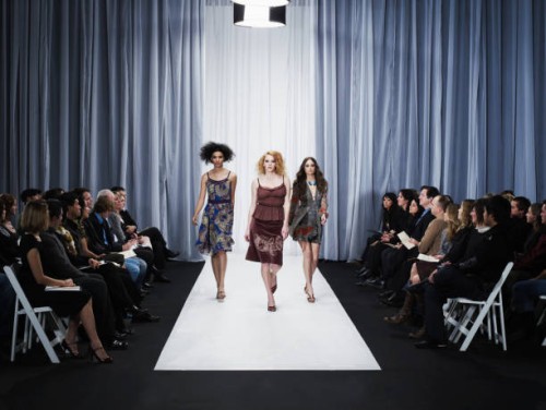 three female models walking down runway - fashion stock-fotos und bilder