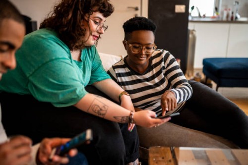 three friends order food - junk food stock pictures, royalty-free photos & images