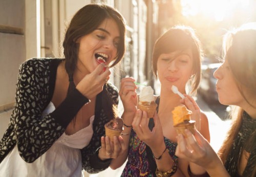 three girlfriends eating icecream - food stockfoto's en -beelden