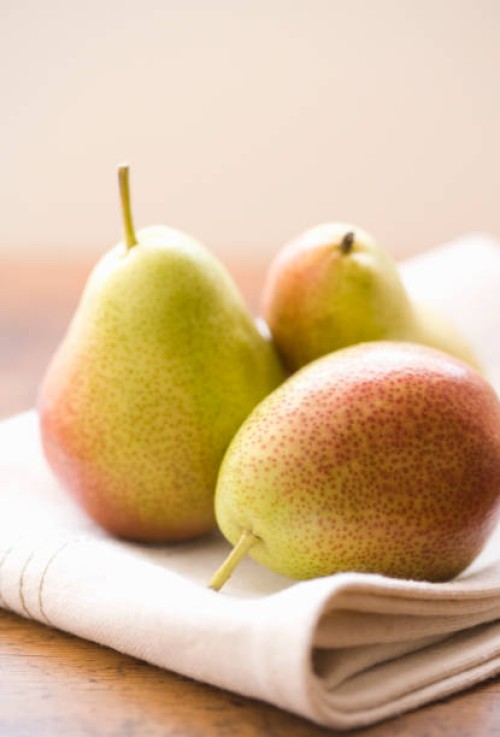 three pears (focus on pear in foreground) - home decoration stock pictures, royalty-free photos & images