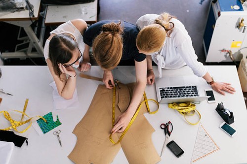 three women fashion designers working with sewing - fashion stock pictures, royalty-free photos & images