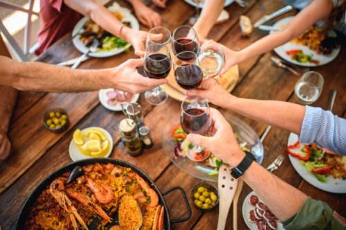 toasting with red wine and water before start of midday meal - food stock pictures, royalty-free photos & images