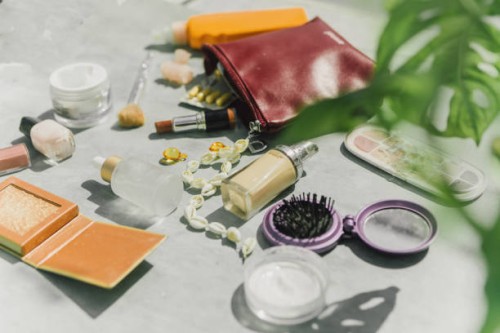 top view cosmetic make-up bag with beauty products - fashion stock pictures, royalty-free photos & images