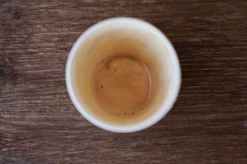 top view of an empty plastic coffee cup on a wooden table in a coffee shop. - junk food stock pictures, royalty-free photos & images
