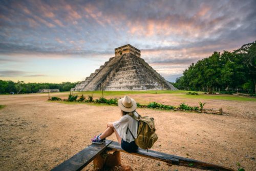 tourist exploring chichen-itza archaeological site, yucatan, mexico - travel stock pictures, royalty-free photos & images