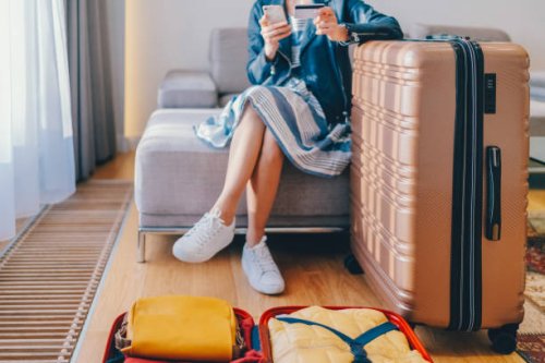 tourist in hotel room flight reservations - travel stock pictures, royalty-free photos & images