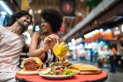 tourists eating and drinking at municipal market - food stock pictures, royalty-free photos & images