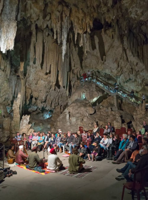 tourists listening to concert in amphitheatre-like chamber in spanish "cueva de nerja" caves - concert stock pictures, royalty-free photos & images