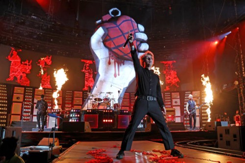 Tré Cool, Billie Joe Armstrong, and Mike Dirnt of Green Day perform onstage as Green Day kicks off their Saviors North America Stadium Tour at...