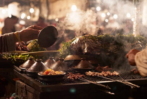 traditional food cooked in open market stall - food stockfoto's en -beelden