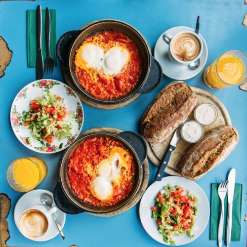 traditional israeli breakfast with shakshuka and hummus, tel aviv, israel - food stock pictures, royalty-free photos & images