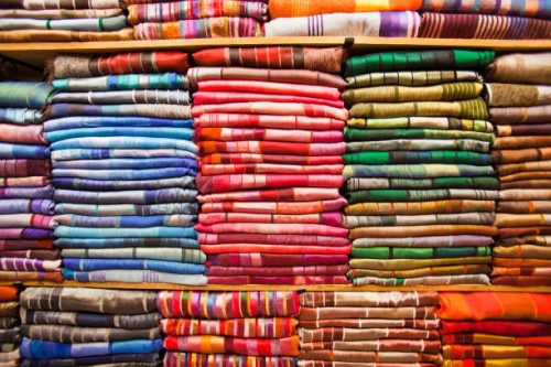 traditional moroccan cloth in a souk in marrakech, morocco, north africa. - fashion stock pictures, royalty-free photos & images