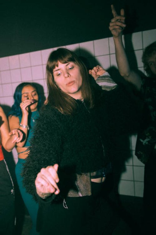 transgender woman dancing against friends at nightclub - concert stock pictures, royalty-free photos & images