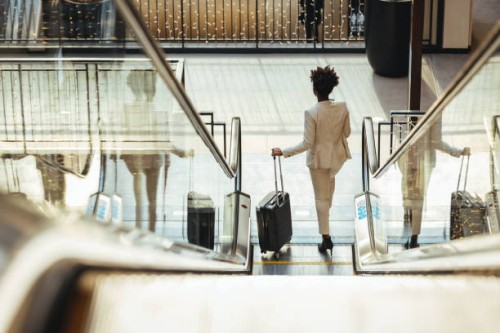 traveler in airport - fashion stock pictures, royalty-free photos & images