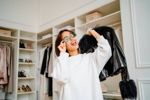 trendy female shopping in the clothes and boot boutique - fashion stock pictures, royalty-free photos & images