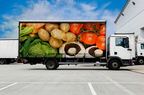 truck with vegetables parked outside distribution warehouse - food stock pictures, royalty-free photos & images