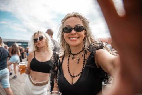 two beautiful senior female friends at a dance event - concert stock pictures, royalty-free photos & images