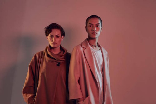 two beautiful young people looking in camera - fashion stock pictures, royalty-free photos & images