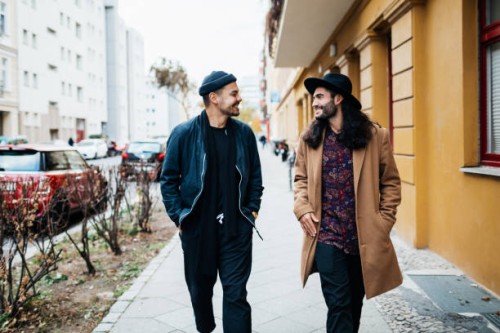 two friends on their way to bar together - fashion stock pictures, royalty-free photos & images