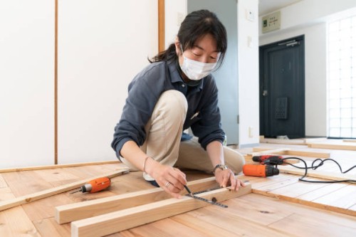 two friends work on a diy project - home decoration stock pictures, royalty-free photos & images