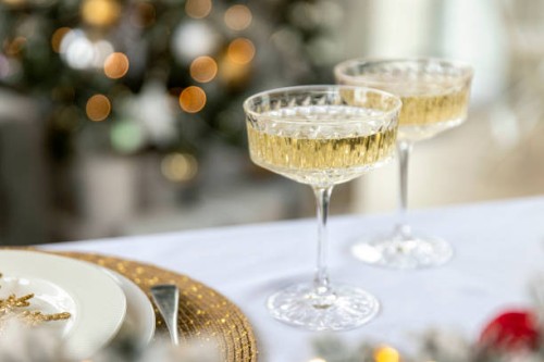 two glasses of champagne on christmas table - home decoration stock pictures, royalty-free photos & images