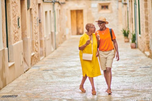 two mature women walking together - travel stock pictures, royalty-free photos & images