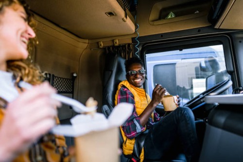 two truck drivers eating on lunch break - junk food stock pictures, royalty-free photos & images