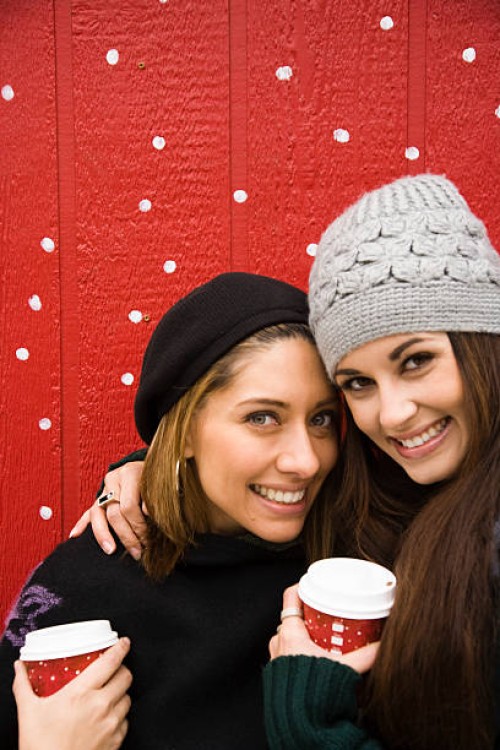 two women with hot beverages - junk food stock pictures, royalty-free photos & images