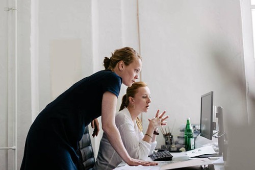 two women working in an office - fashion stock pictures, royalty-free photos & images
