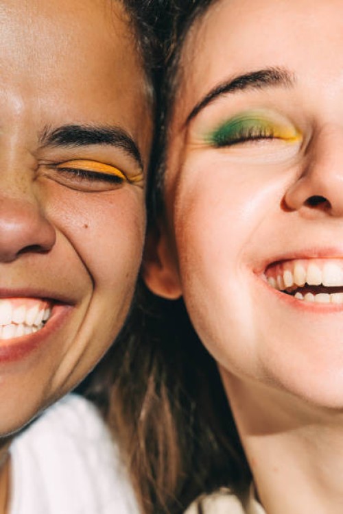 two young beautiful women with bright make-up close-up. diversity concept. - fashion stock pictures, royalty-free photos & images