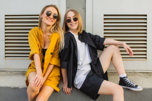 two young women in suit. lifestyle. blonde hair. youth culture. fashion - fashion stock pictures, royalty-free photos & images
