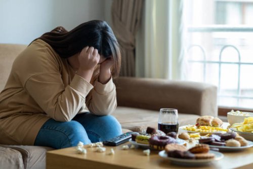 unhappy stressed woman - junk food stock pictures, royalty-free photos & images