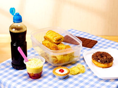 unhealthy lunch box on table cloth - junk food stock pictures, royalty-free photos & images