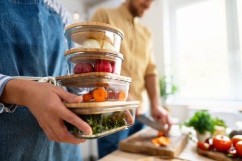 unrecognizable multiracial couple, preparing and storing vegetables for a weekly usage - food stock pictures, royalty-free photos & images