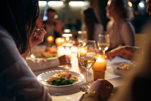 unrecognizable multiracial female and male friends, having the dinner at the restaurant balcony - food stock pictures, royalty-free photos & images