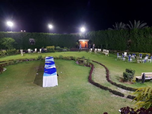 unrecognizable people walking in a garden after party is over at night. - garden decoration stock pictures, royalty-free photos & images