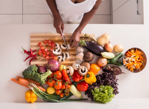 unrecognized women preparing fresh healthy salad. - food stock pictures, royalty-free photos & images