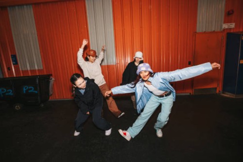 urban style women dancing outdoors in the city streets - fashion stock pictures, royalty-free photos & images