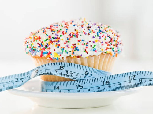 usa, new jersey, jersey city, close up of cupcake with measuring tape - junk food stock pictures, royalty-free photos & images
