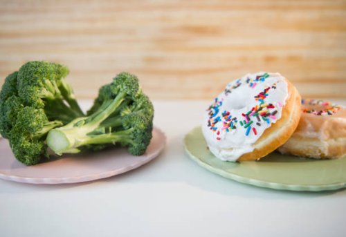 usa, new jersey, jersey city, donuts against broccoli - junk food stock pictures, royalty-free photos & images