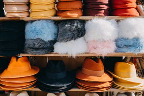 variation of headwear on shelves - fashion stock pictures, royalty-free photos & images