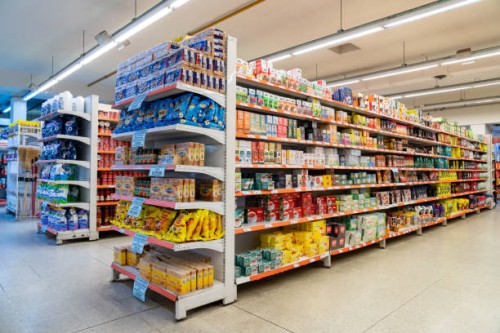variety of products on the different aisles and shelfs at the supermarket - food stockfoto's en -beelden