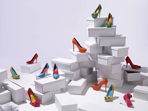 various shoes piled on shoe boxes - fashion stock pictures, royalty-free photos & images