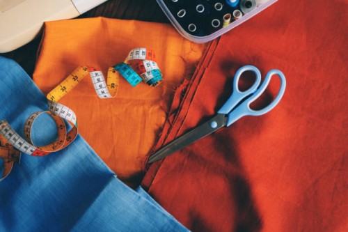 various type of sewing tools on the vibrant linen textile - fashion stock pictures, royalty-free photos & images